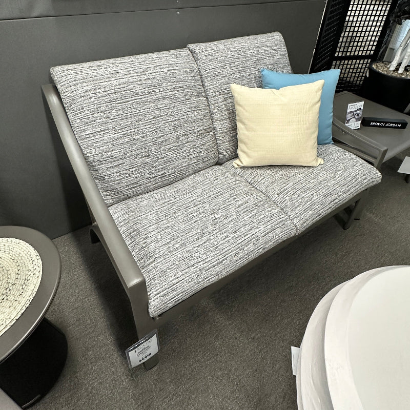 Gray sofa with decorative pillows in a room setting
