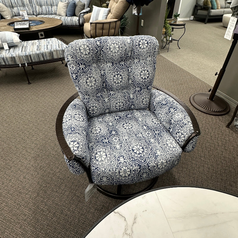 Decorative armchair with floral pattern in a showroom setting