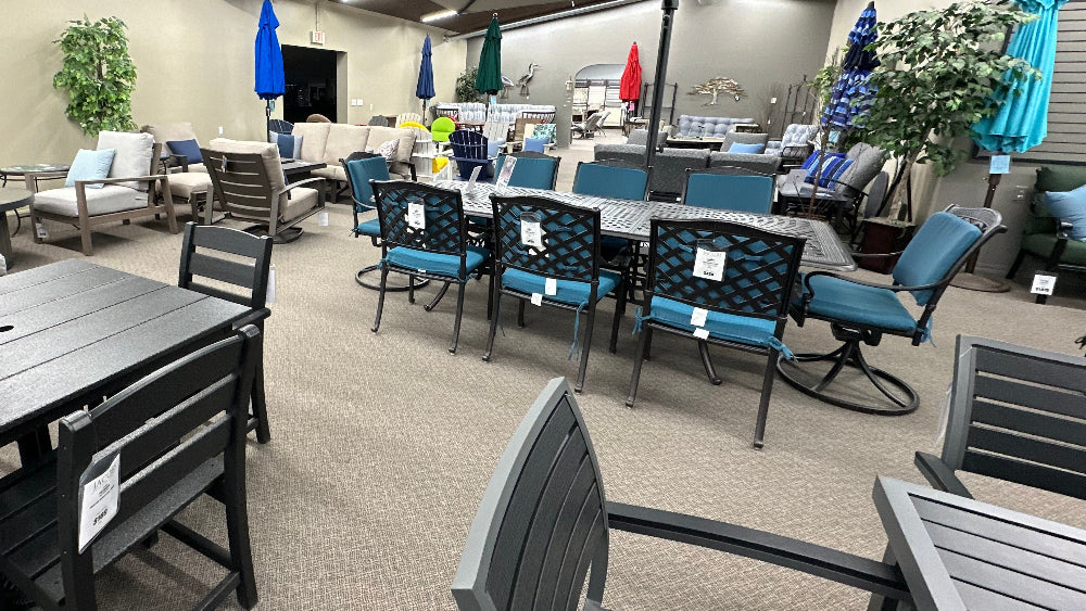patio furniture collections on a showroom floor