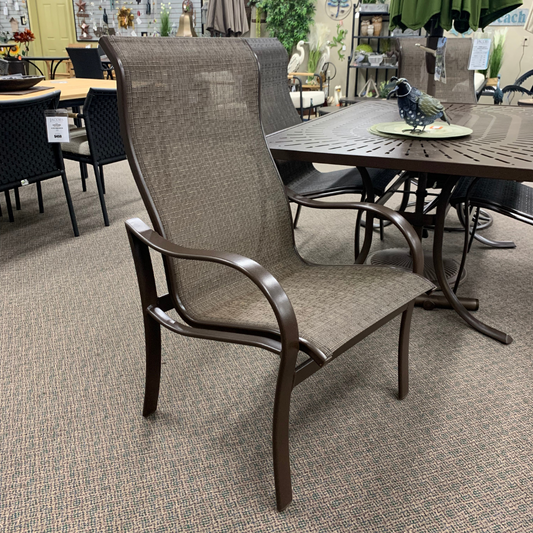 The Tropitone Shoreline High Back Dining Arm Chair is available at Jacobs Custom Living Spokane Valley WA showroom.