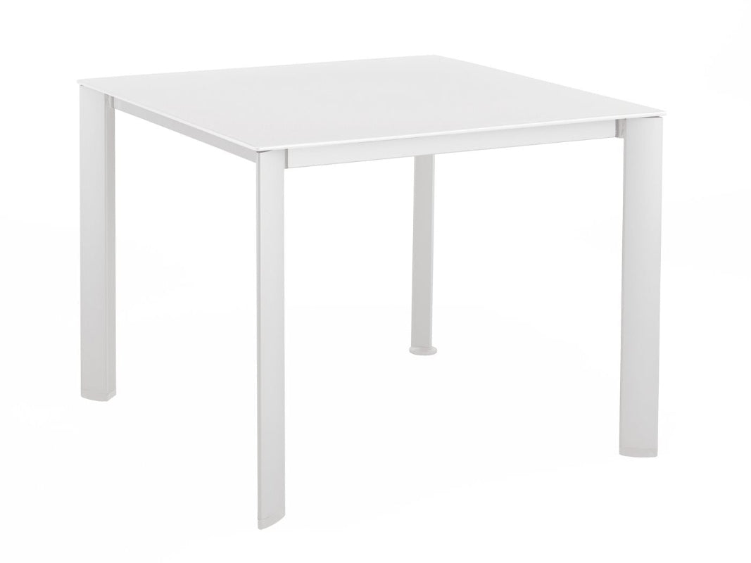 A white rectangular loft patio dining table with metal legs.