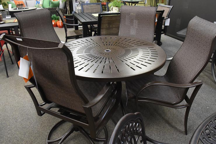 The Tropitone La'Stratta 48" Umbrella Dining Table" is available in our Jacobs Custom Living Spokane Valley showroom.