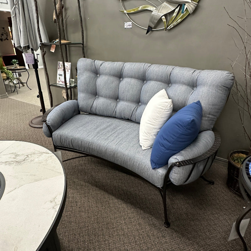 Gray sofa with decorative pillows in a room setting