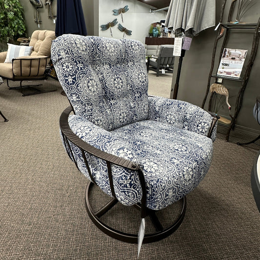 Decorative chair with floral pattern in a showroom setting