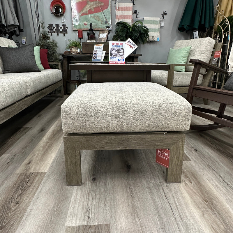 Outdoor patio area with furniture and decor on a wooden deck