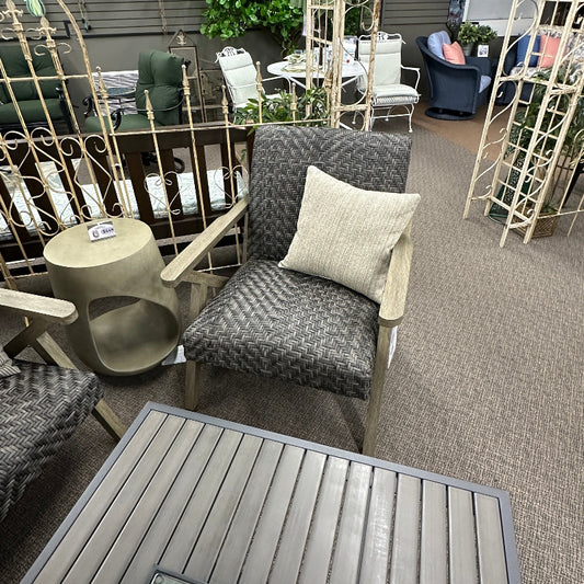 Outdoor patio area with furniture, fire pit, and decorative elements.