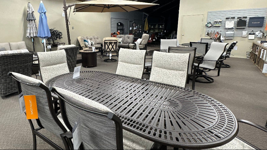 various patio furniture collections at a showroom floor