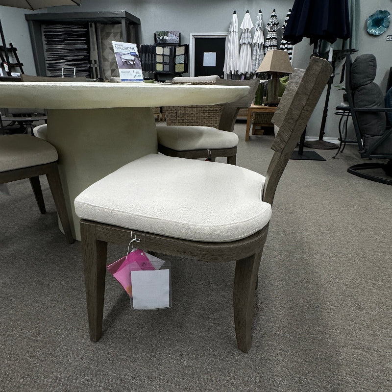 Chair with a white cushion in a showroom setting