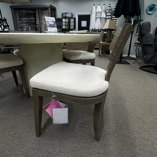 Chair with a white cushion in a showroom setting