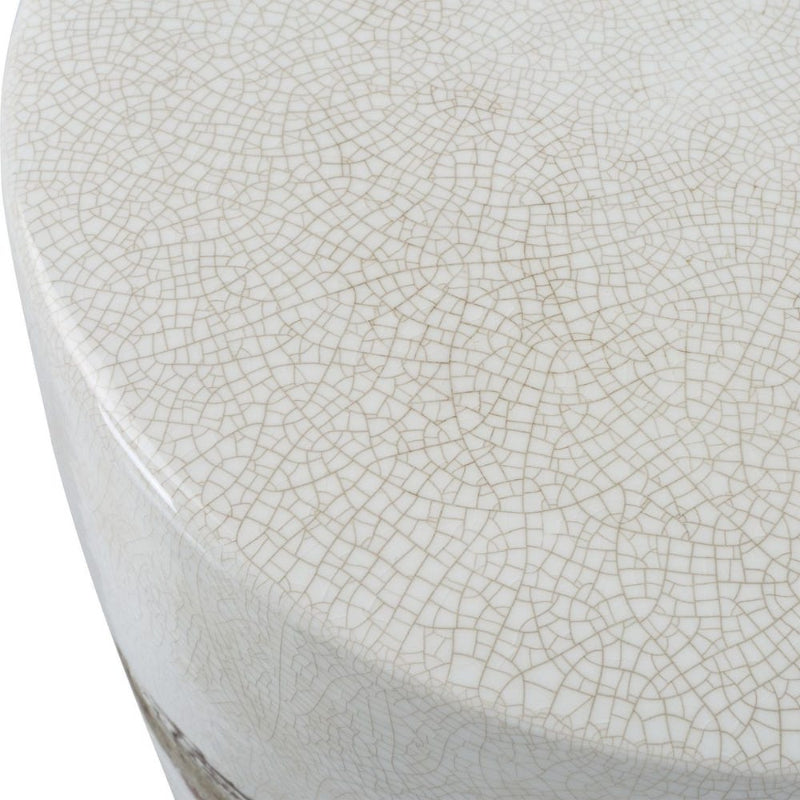 Close-up of a white ceramic stool with a textured surface