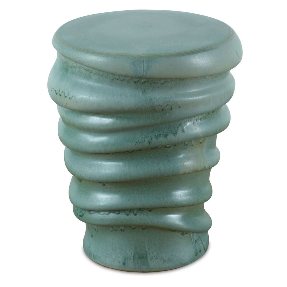 Decorative turquoise stool with ribbed texture on a white background