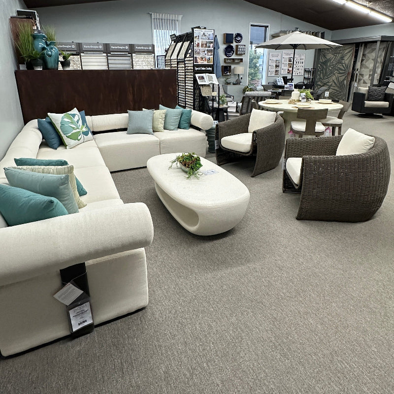 Modern living room setup with furniture in a showroom.