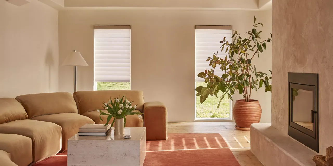 Modern living room with beige sofa, coffee table, and decorative elements.
