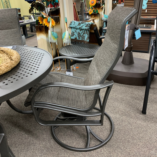 Tropitone Shoreline Padded Sling High Back Swivel Rocker Dining Chair is available at Jacobs Custom Living in Spokane Valley, WA.