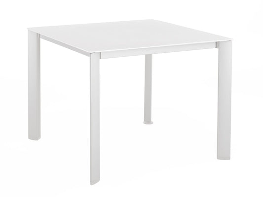 A white rectangular loft patio dining table with metal legs.