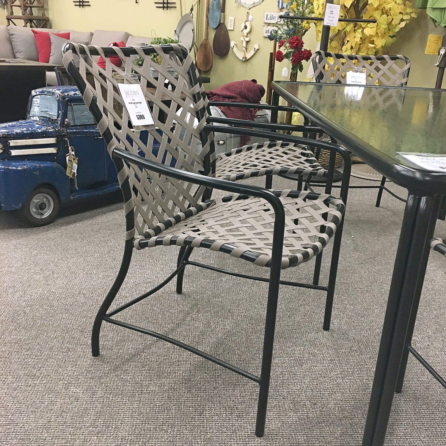 The Brown Jordan Outdoor Tamiami Dining Arm Chair is available in our Jacobs Custom Living Spokane Valley showroom.